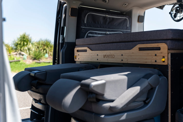 Rover camping pod sliding bed system for. camping and keeping a rear seats inside a campervan.