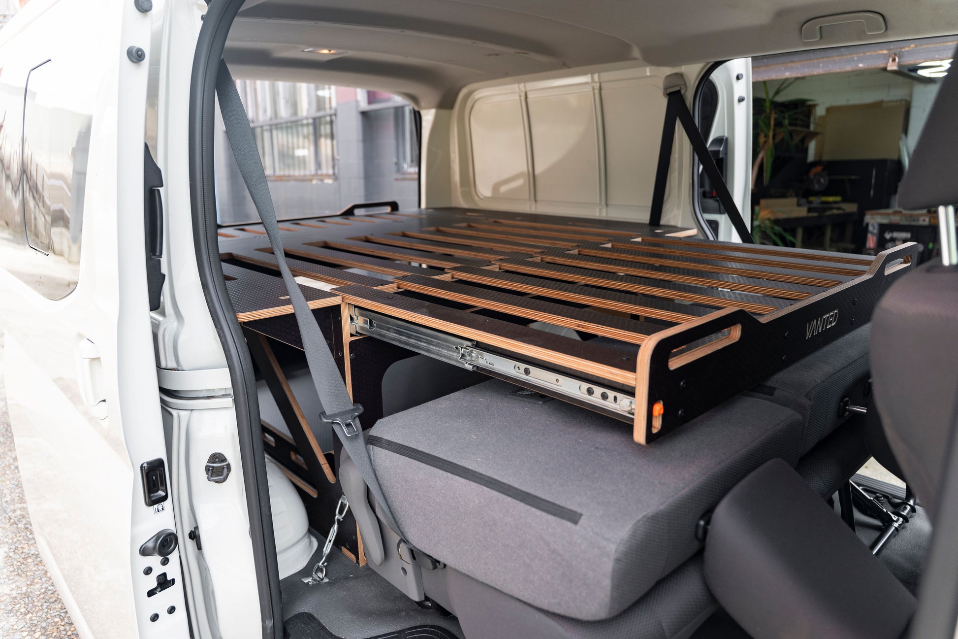 Vanted Cross modular pod in Toyota Hiace LWB — rear hatch view, storage mode, ready for camping
