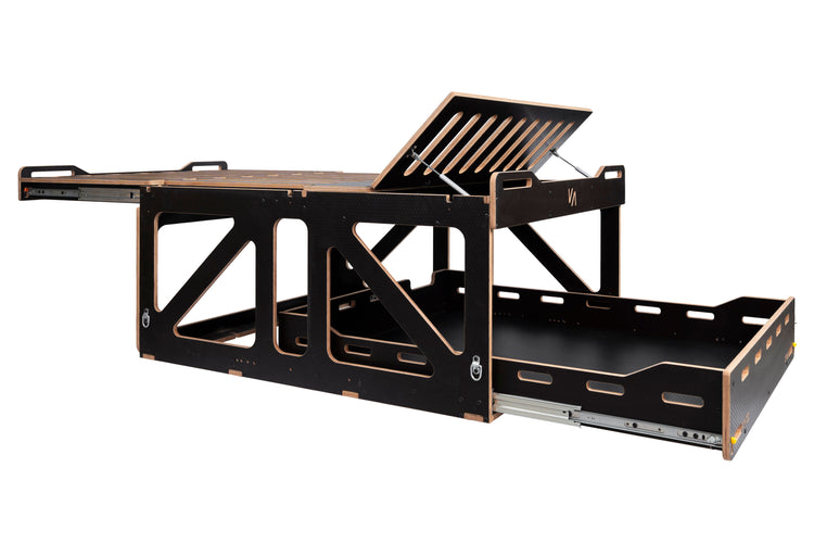 Vanted Cross camping pod — angled view showing storage compartment and plywood frame construction

