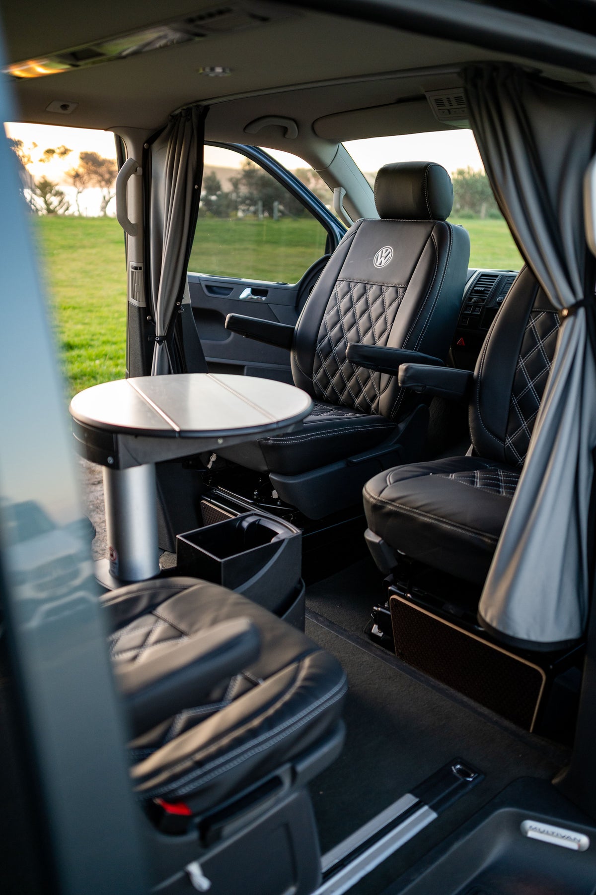 "Black leather seat covers installed in VW Transporter Multivan"